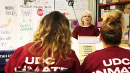 Female offender giving speech to fellow makin it work graduates