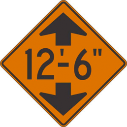 Low clearance feet and inches orange sign