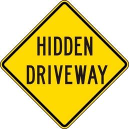 Hidden driveway sign