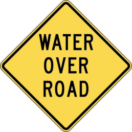Water over road sign
