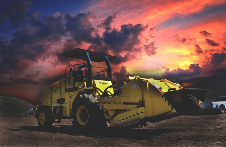 Heavy machinery on construction site at sunrise