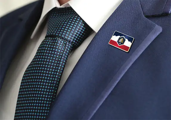 Closeup of state flag pin on lapel