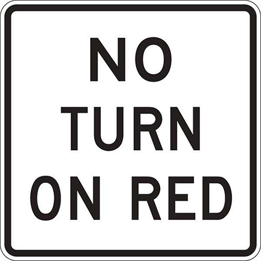 A "No Turn On Red" sign in black text on a white background.